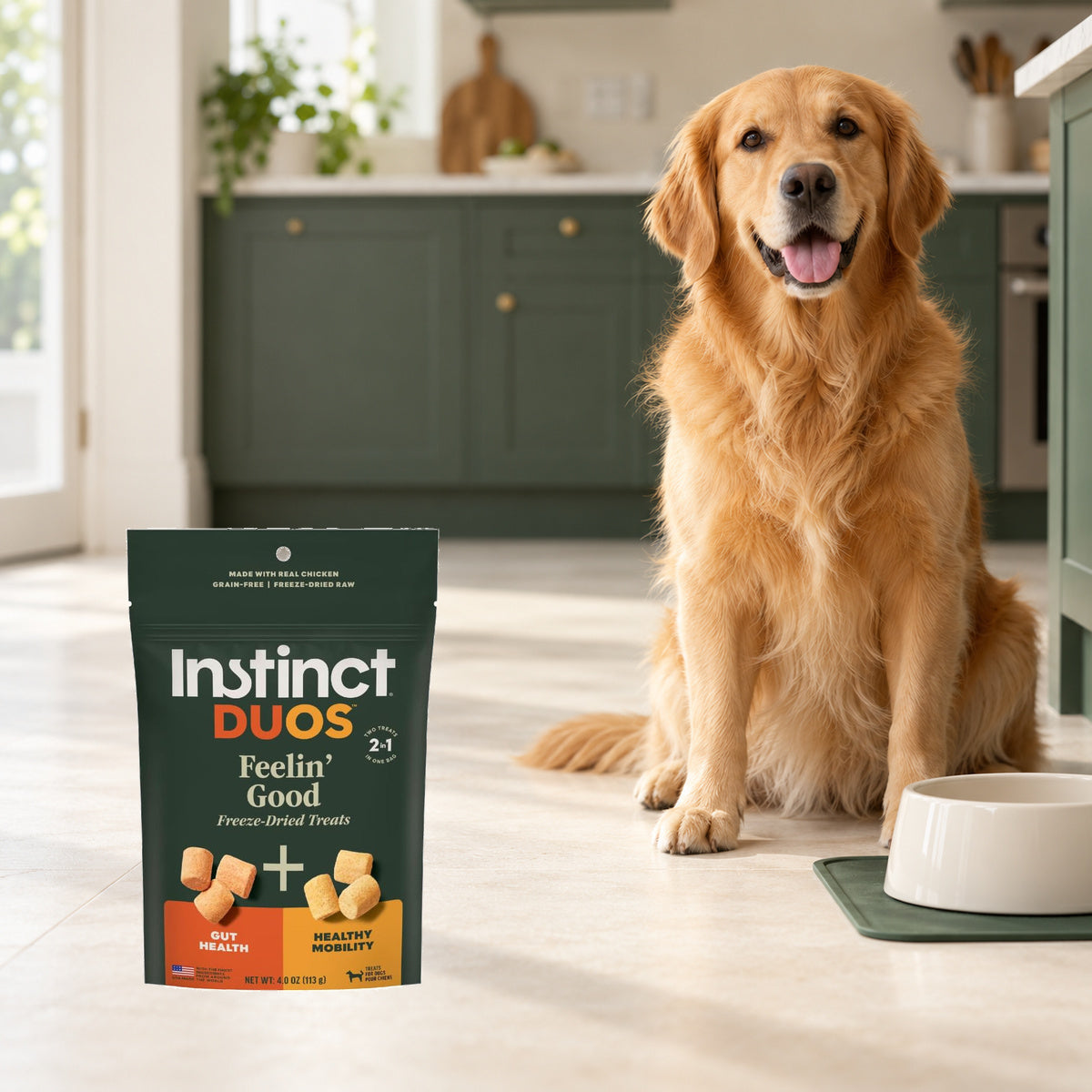 Instinct Duos Feelin’ Good Chicken Dog Treats – 4 oz — packaging in a cream and forest-green mealtime scene